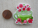 Second view of Green Tea Cup with Pink Flowers Needle Minder.