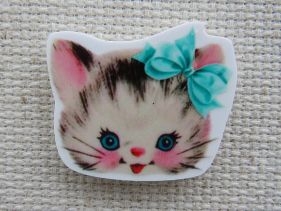 First view of Kitten Face with a Blue Bow Needle Minder.