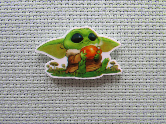 First view of the Sitting Smiling Alien Child Needle Minder