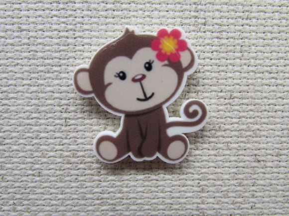 First view of the Monkey with a Pink Flower Needle Minder