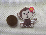 Second view of the Monkey with a Pink Flower Needle Minder