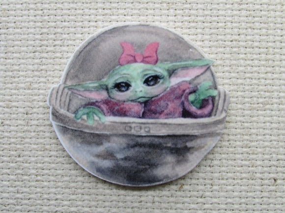 First view of the Alien Child with a Pink Bow Needle Minder