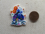 Second view of the Alice Amongst the Flowers Needle Minder