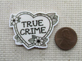 Second view of the True Crime Heart Needle Minder