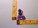 Third view of the Purple Witch Cat Sitting on a Stack of Books Needle Minder
