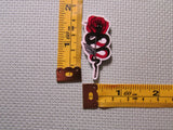 Third view of the Snakes and Roses Needle Minder