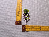 Fourth view of the Snakes and Roses Needle Minder