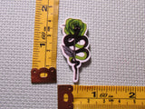 Fourth view of the Snakes and Roses Needle Minder