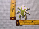 Third view of the Green Sparkly Spider Needle Minder