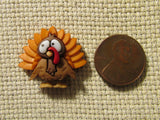 Second view of the Orange Feathered Turkey Needle Minder