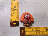 Third view of the Orange Feathered Turkey Needle Minder