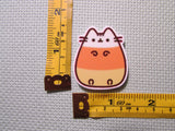 Third view of the Candy Corn Kitty Needle Minder