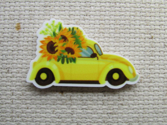 First view of the Yellow Bug Car Bursting with Sunflowers Needle Minder