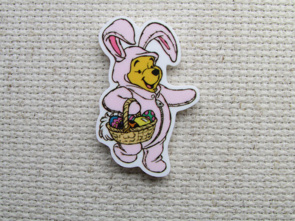 First view of the Pooh Bear Dressed as a Cute Pink Bunny with a Basket of Eggs Needle Minder