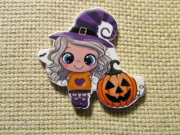 First view of the Cute Girl Witch with a Jack O Lantern Needle Minder