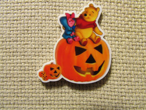 First view of the Halloween Pooh and Piglet Sitting on a Jack O Lantern Needle Minder