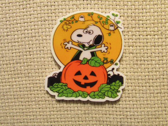 First view of the Vampire Snoopy Jumping out of a Carved Pumpkin Needle Minder