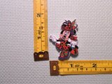 Third view of the Minnie Mouse Dressed as an Orange Witch Needle Minder