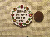 Second view of the Blossom Wherever Life Plants You Flower Wreath Needle Minder