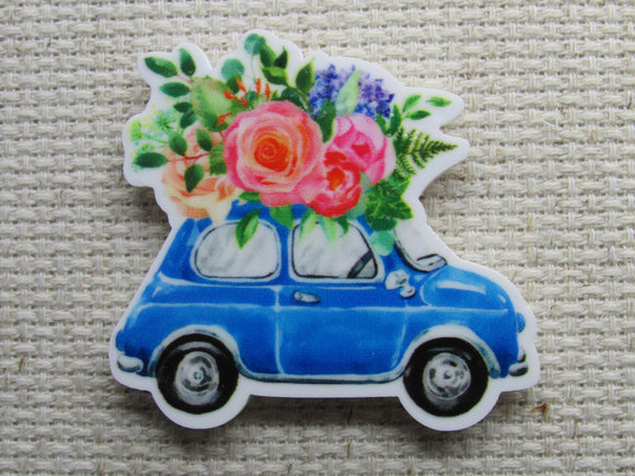 First view of the Cute Blue Car with Beautiful Flowers on Top Needle Minder 