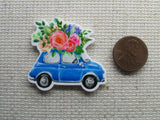 Third view of the Cute Blue Car with Beautiful Flowers on Top Needle Minder