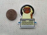 Third view of alien in a basket needle minder.