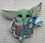 Second view of Alien Child Playing with a Frog Needle Minder.