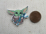 Third view of Alien Child Playing with a Frog Needle Minder.