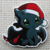 Close up view of Toothless with a Santa hat needle minder.