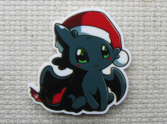 First view of Toothless with a Santa hat needle minder.