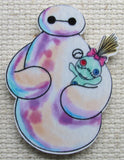 Close up view of Baymax Holding a Scrump Doll Needle Minder.