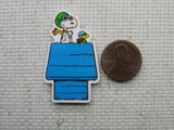 Third view of Red Baron Snoopy on a Blue Doghouse Needle Minder.