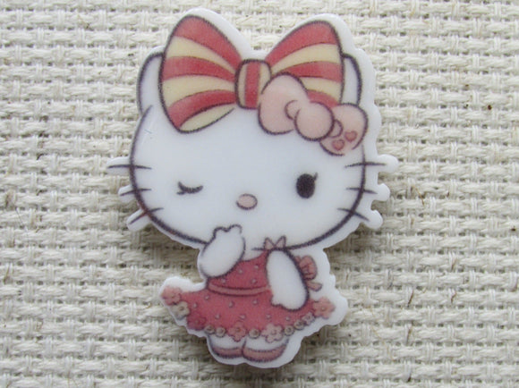 First view of Winking Pretty White Kitty with a Striped Pink Bow Needle Minder.