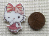 Third view of Winking Pretty White Kitty with a Striped Pink Bow Needle Minder.