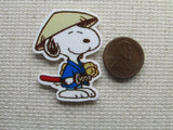 Third view of Snoopy as a Karate Sensei needle minder.