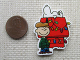 Second view of Charlie Brown and Snoopy with a Doghouse Decorated for Christmas Needle Minder.