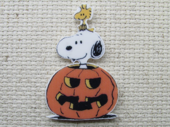 First view of Snoopy popping his head out of the carved pumpkin needle minder.