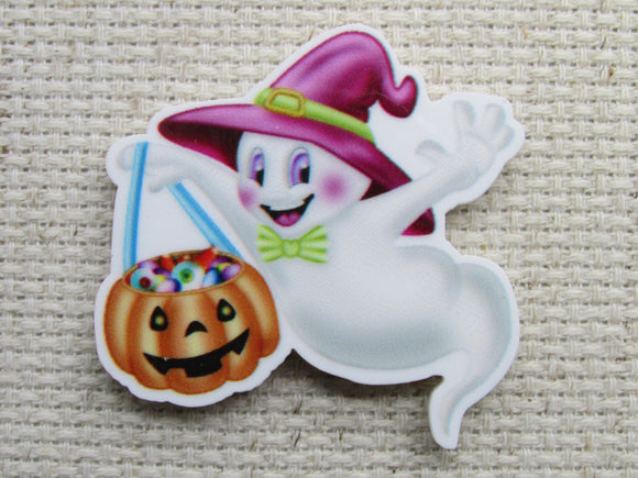 First view of cartoon ghost with a pumpkin bucket needle minder. 