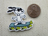 Second view of Snoopy on a Woodstock Powered Hover Board Needle Minder.