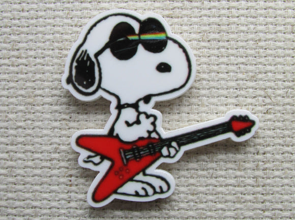 First view of Snoopy Playing a Guitar Needle Minder.