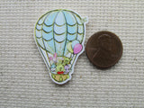 Second view of Winnie the Pooh and friends in a hot air balloon needle minder.