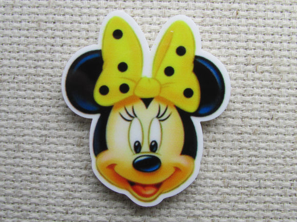 First view of Minnie Mouse with a Yellow Polka Dot Bow Needle Minder.