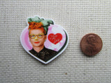 Second view of I Love Lucy needle minder. 