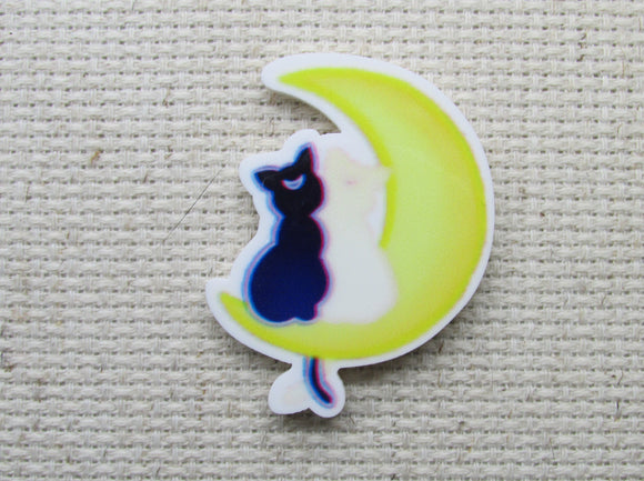 First view of Black Moon Cat on a Yellow Moon Needle Minder.