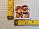 Third view of the Ellie Kissing Carl Needle Minder