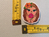 Third view of the Adorable Flower Holding Hedgehog Needle Minder