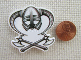 Second view of Helmet and a Pair of Axes Needle Minder.