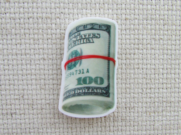First view of A Roll of Bills Needle Minder.