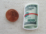 Second view of A Roll of Bills Needle Minder