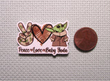Second view of peace love baby Yoda needle minder.